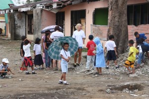 kids helping to clear debris